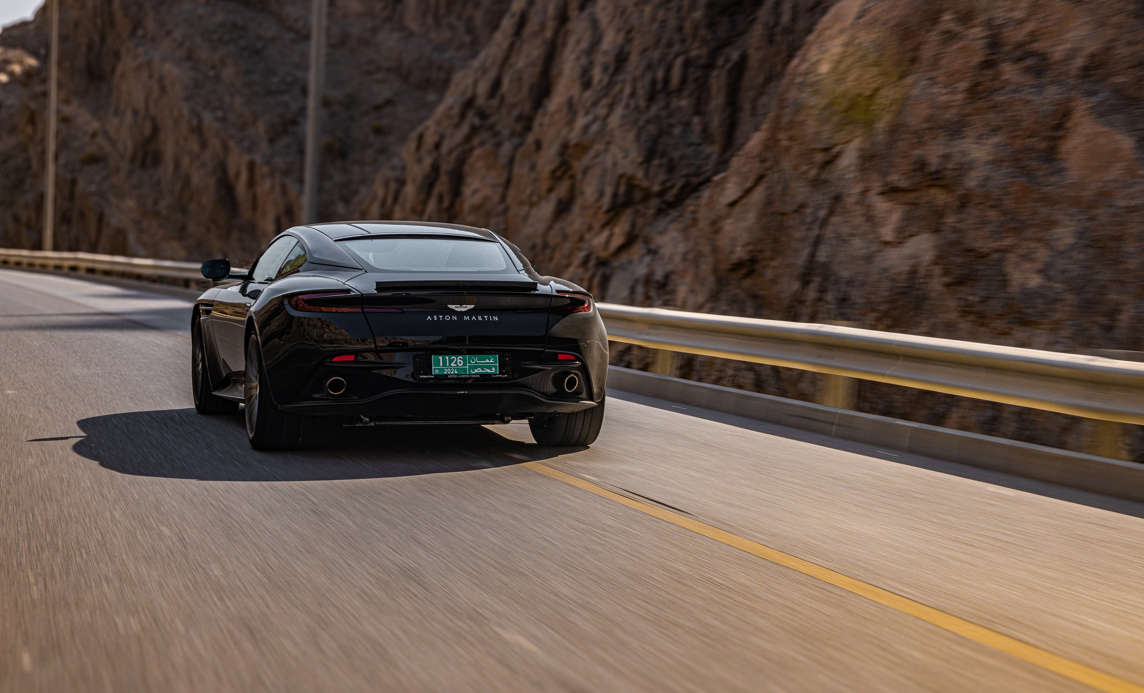 Aston Martin from rear in motion
