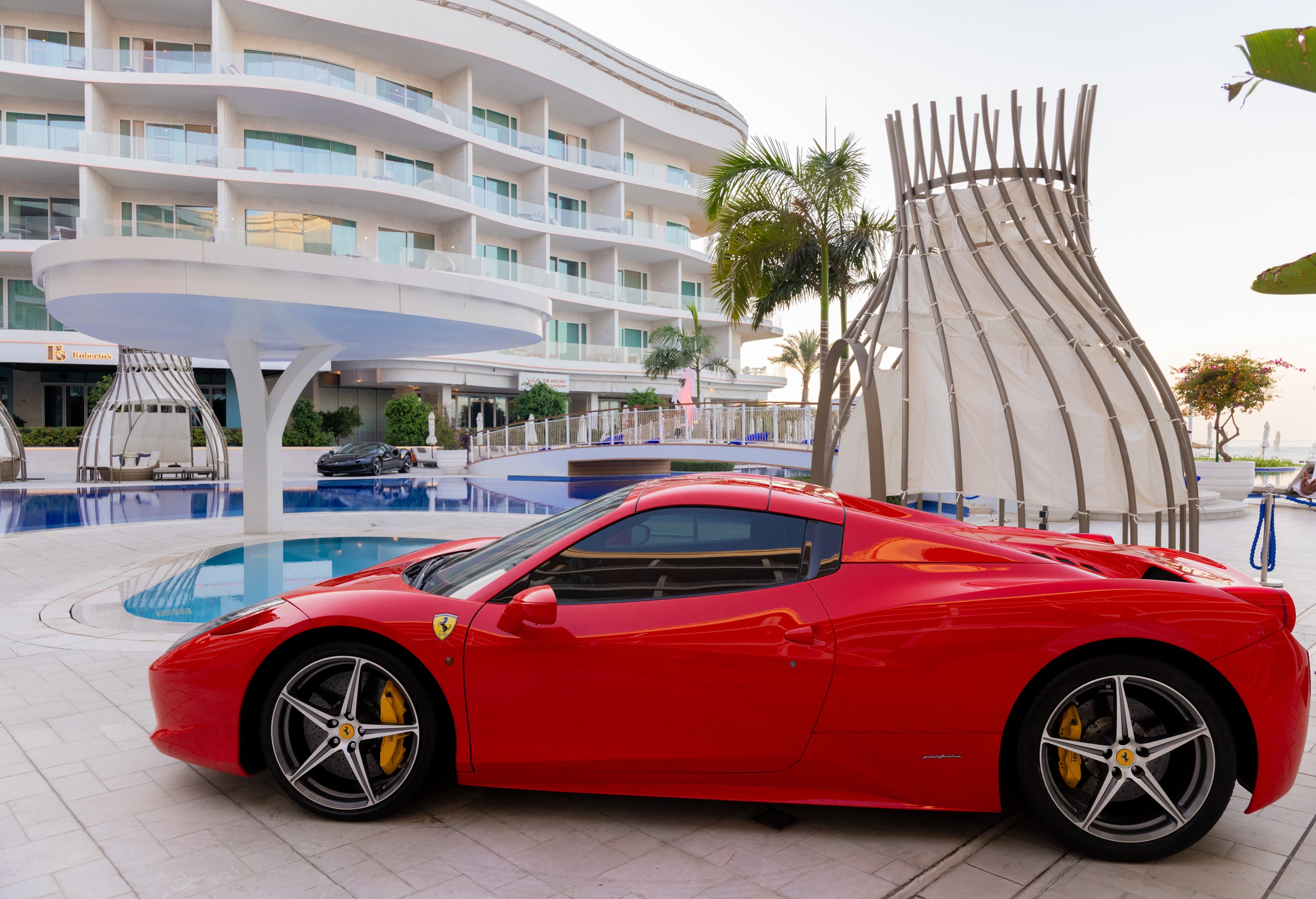 Red Ferrari at luxury resort