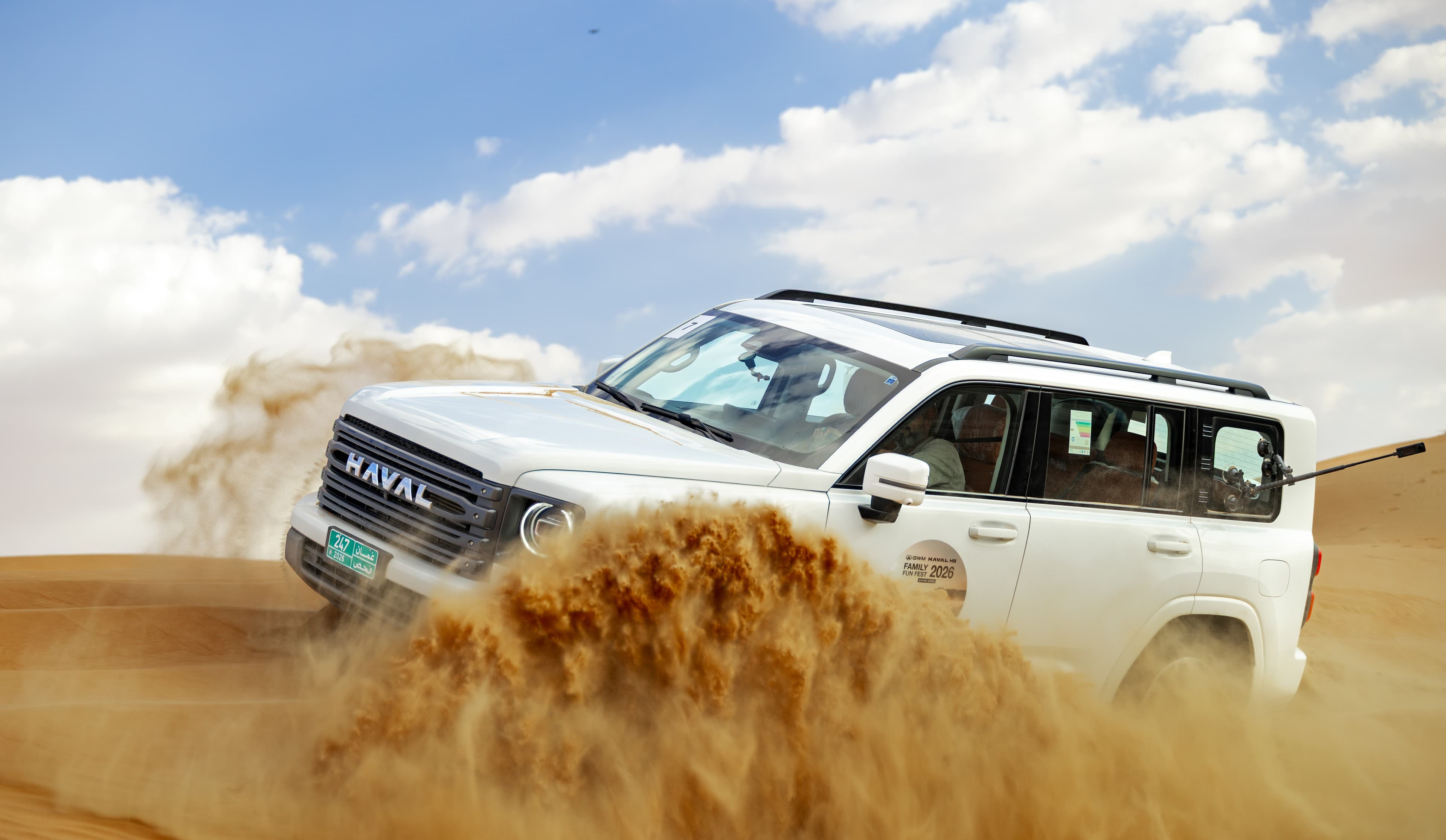 SUV pushing a wall of sand