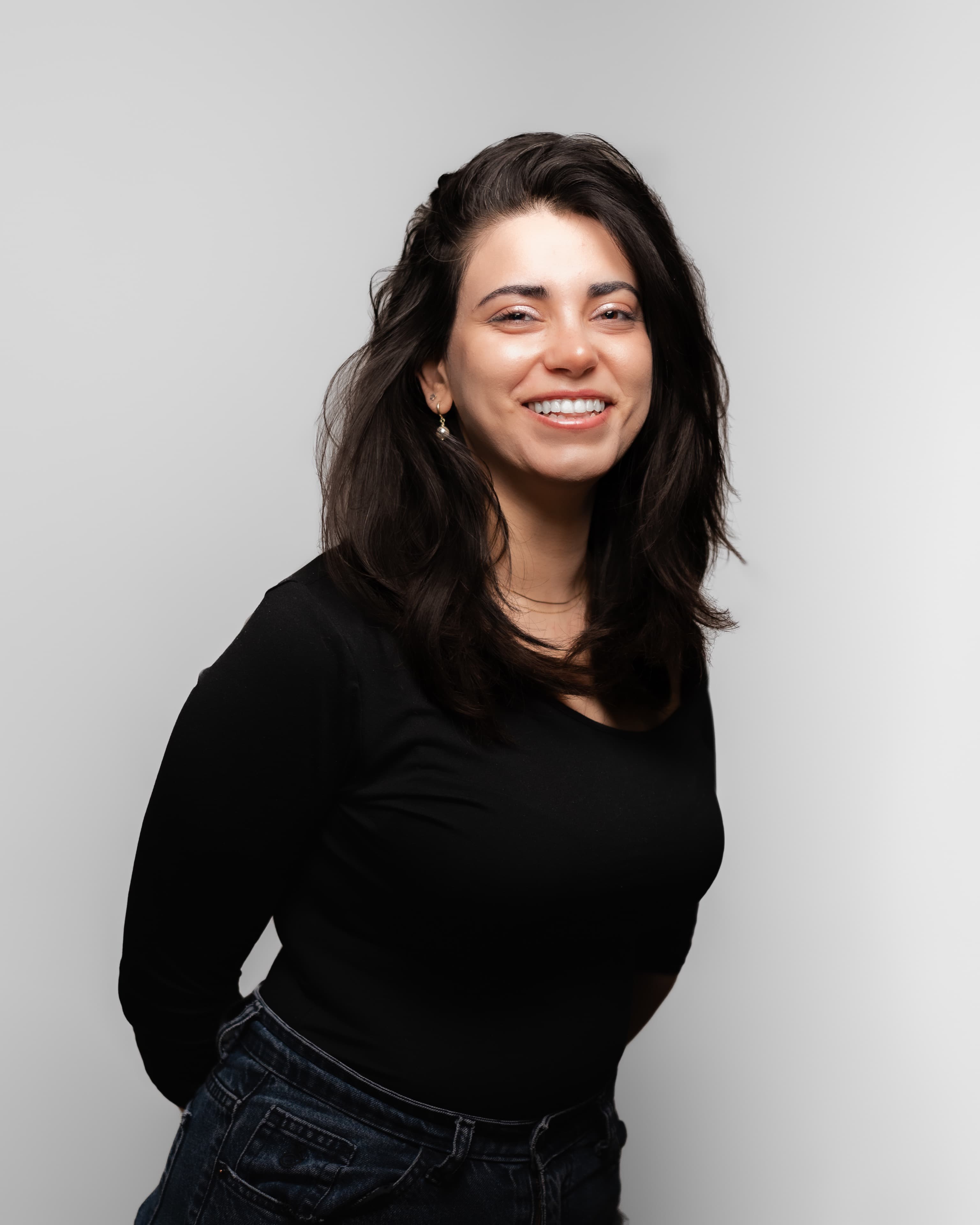 Studio business portrait of a woman against a light grey backdrop